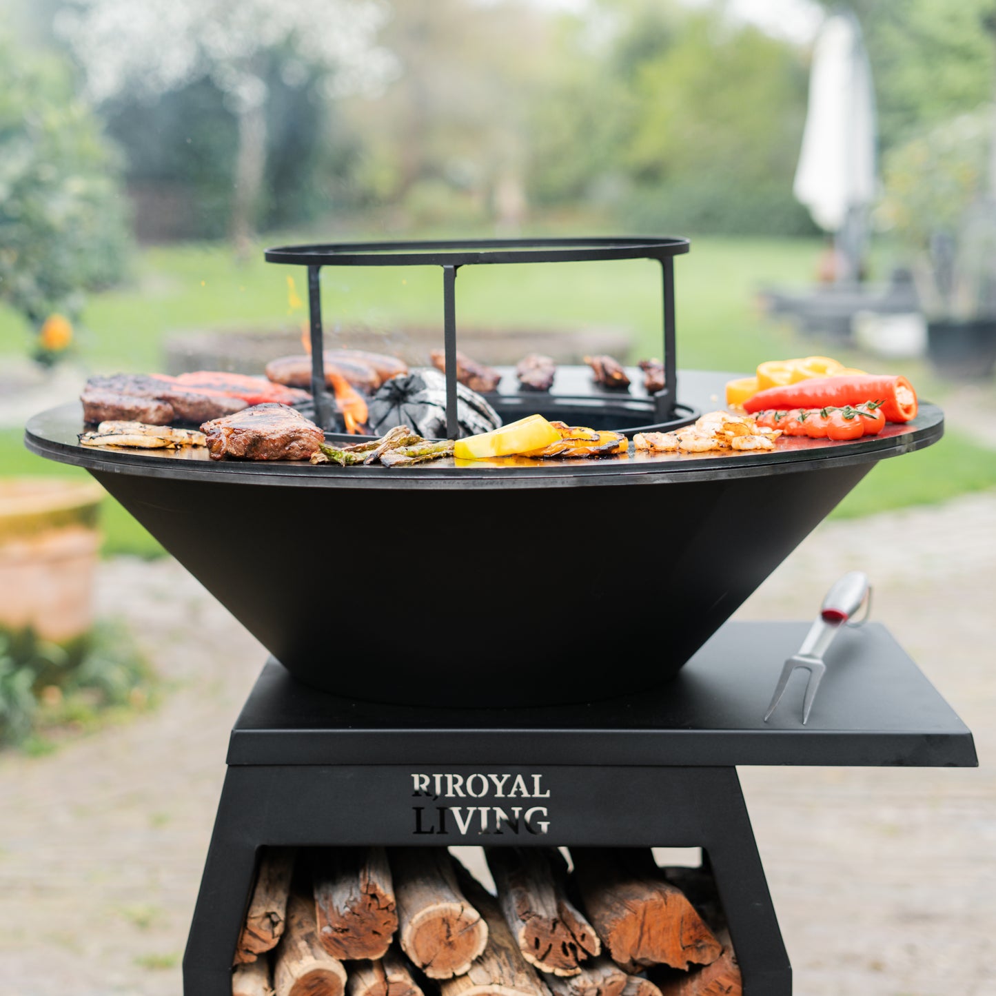 BBQ Plancha Grill Compañero XXL Blackline - With poker and wood storage Ø80cm