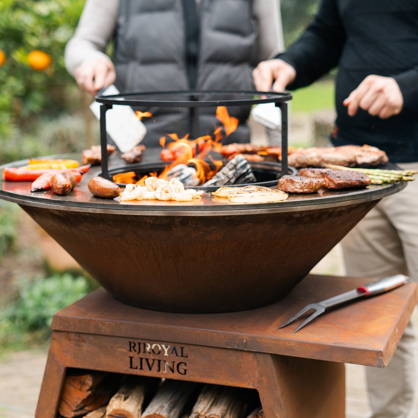BBQ Plancha Grill Compañero XXL Corten steel - With poker and wood storage Ø80cm