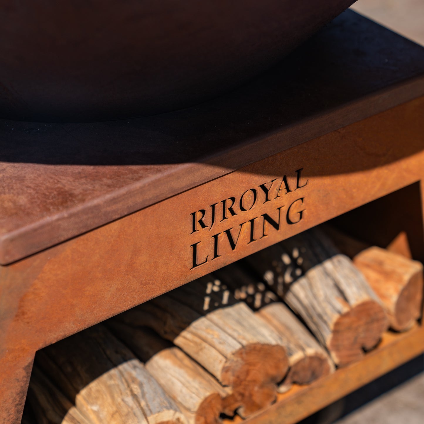 BBQ Plancha Grill Brasero Corten steel fire pit with large wheels and wood storage Ø75cm