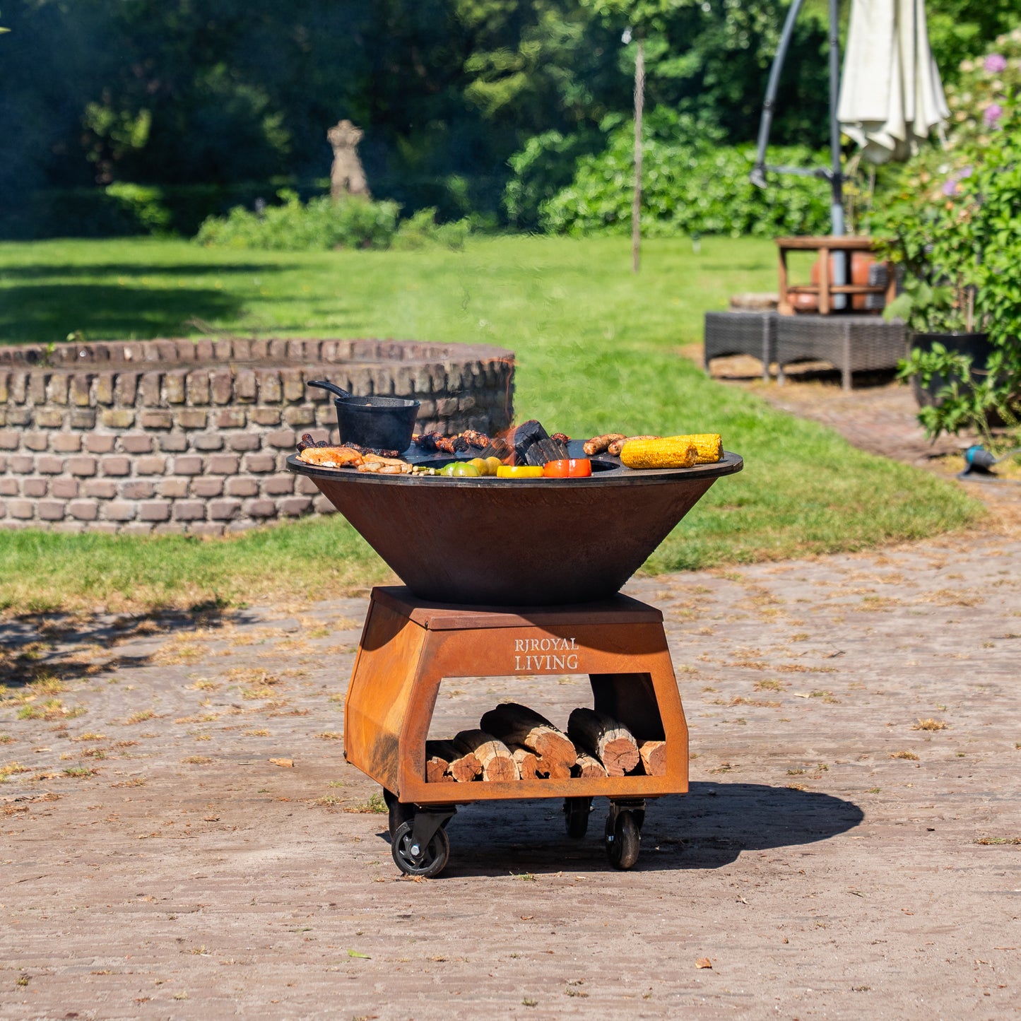 BBQ Plancha Grill Brasero Corten steel fire bowl with large wheels, wood storage and Cooking Plate Ø80cm