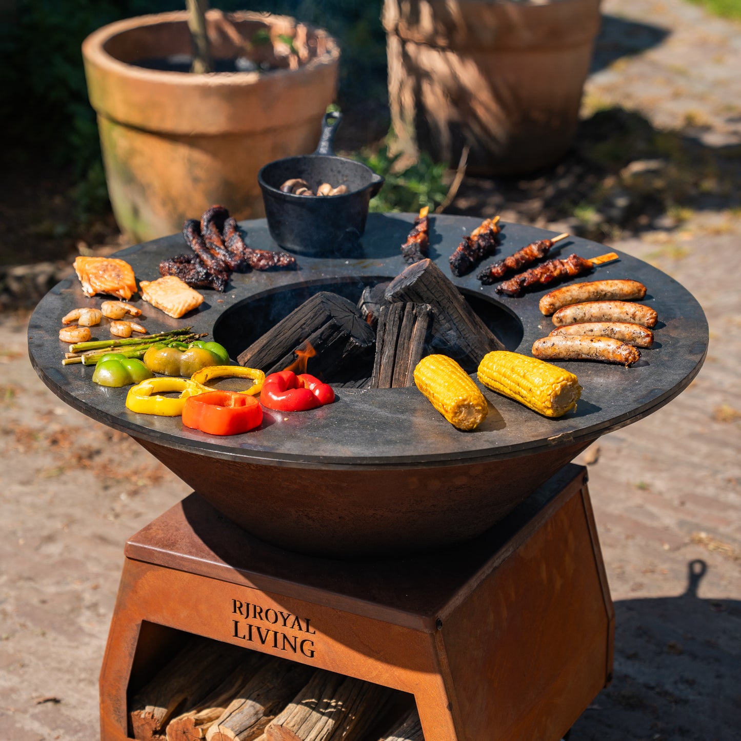 BBQ Plancha Grill Brasero Corten steel fire bowl with large wheels, wood storage and Cooking Plate Ø80cm