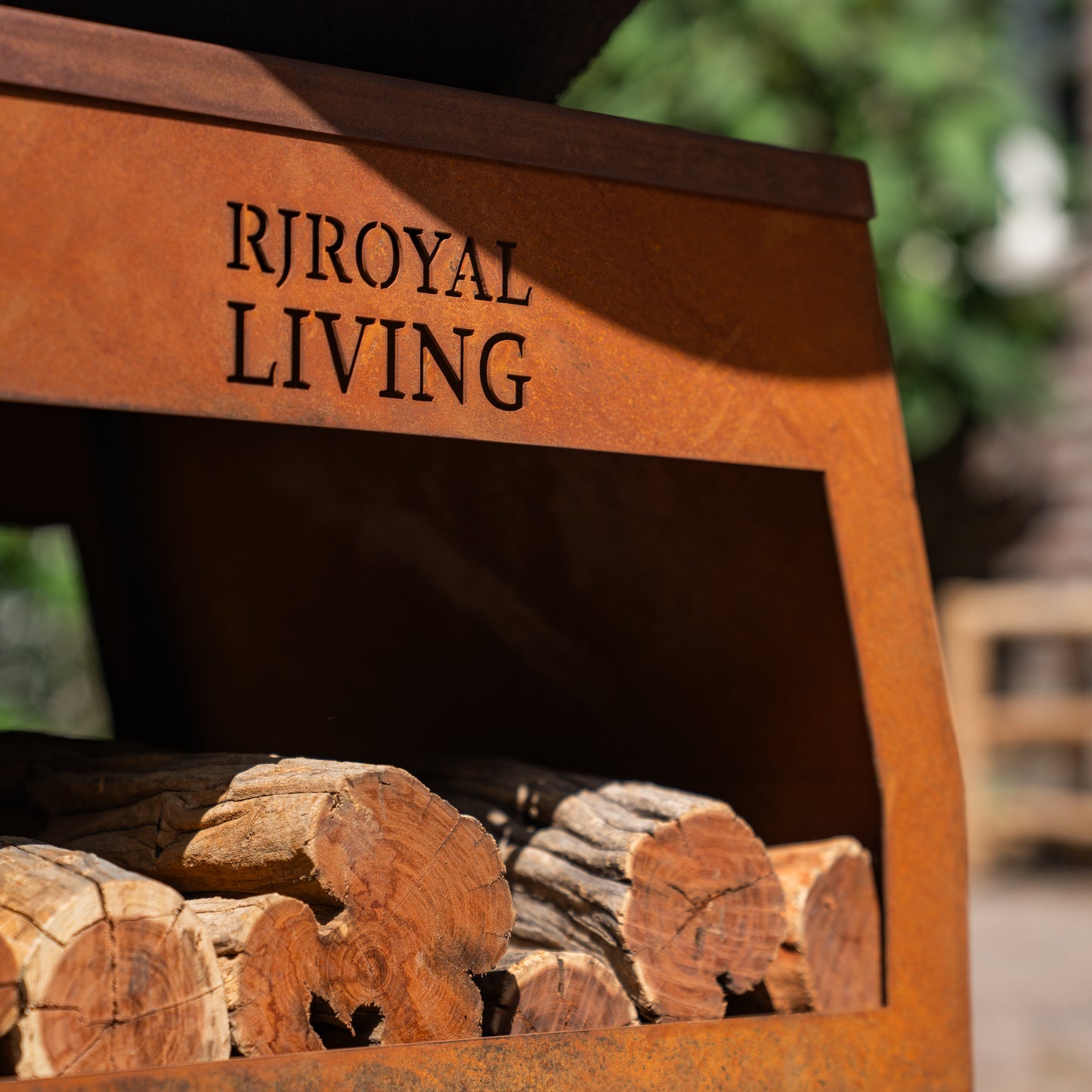 BBQ Plancha Grill Brasero Corten steel fire pit with large wheels and wood storage Ø75cm