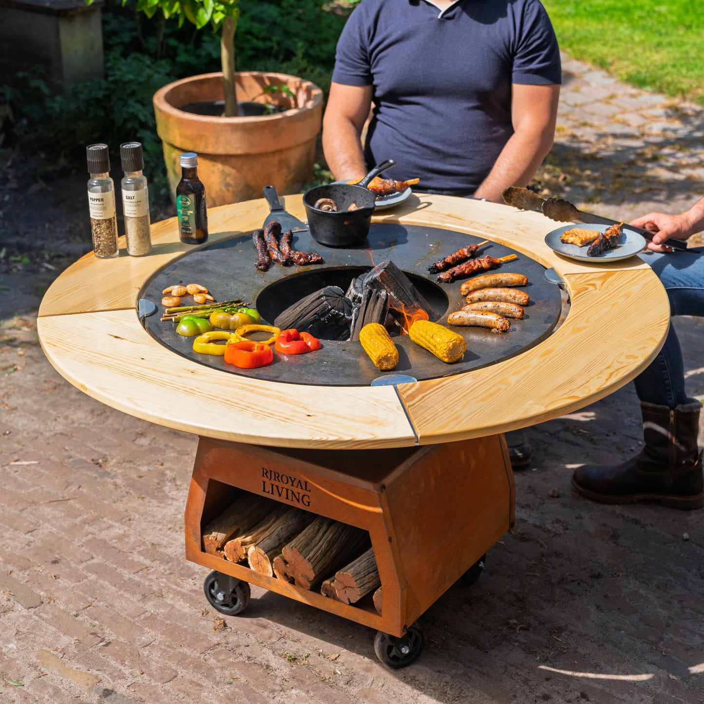 BBQ Plancha Grill Brasero Corten steel fire pit with Cooking plate Ø80cm and Mesa (wooden ring) large wheels, wood storage