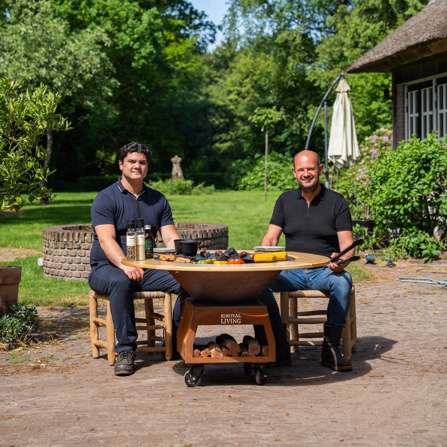 BBQ Plancha Grill Brasero Corten steel fire pit with Cooking plate Ø80cm and Mesa (wooden ring) large wheels, wood storage