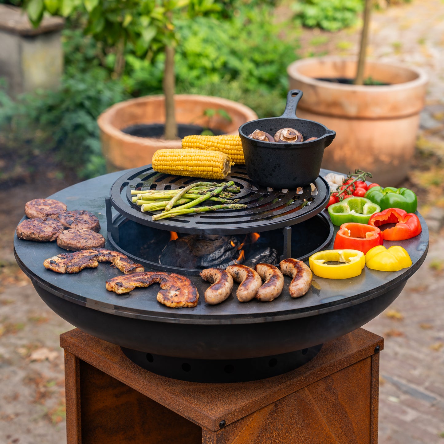 BBQ Plancha Grill Blackline Corten steel 8mm Camarada 2.0 - With poker and wood storage Ø70cm