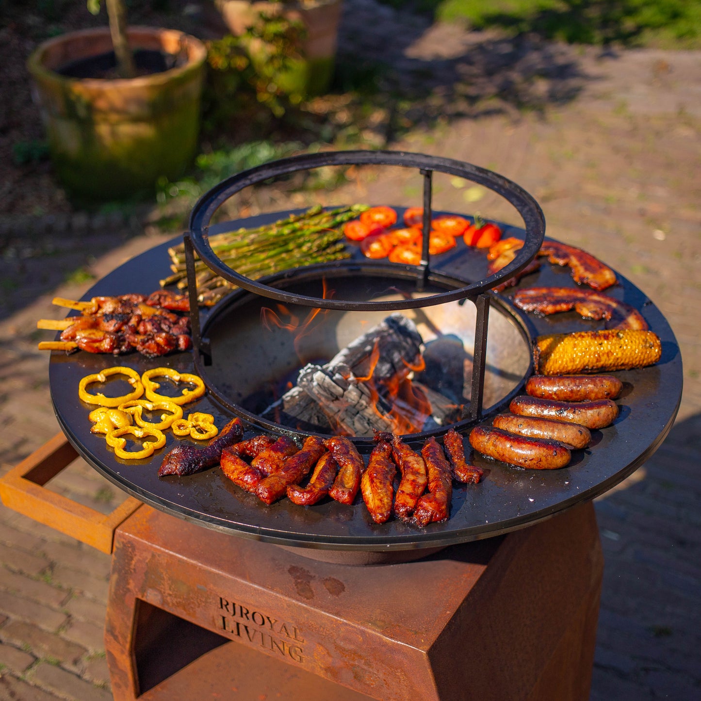 BBQ Plancha Grill Maestro Ø70cm Corten steel - With large wheels and wood storage