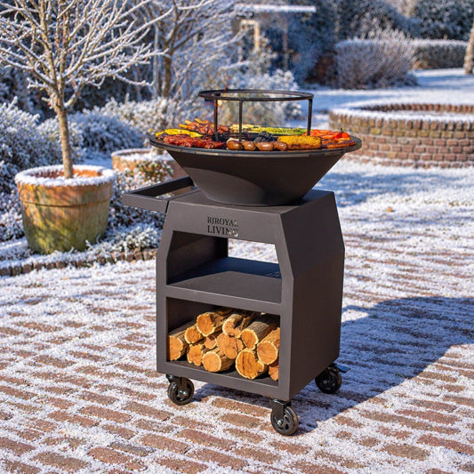 BBQ Plancha Grill Maestro Ø70cm Blackline - With large wheels and wood storage — winter setting